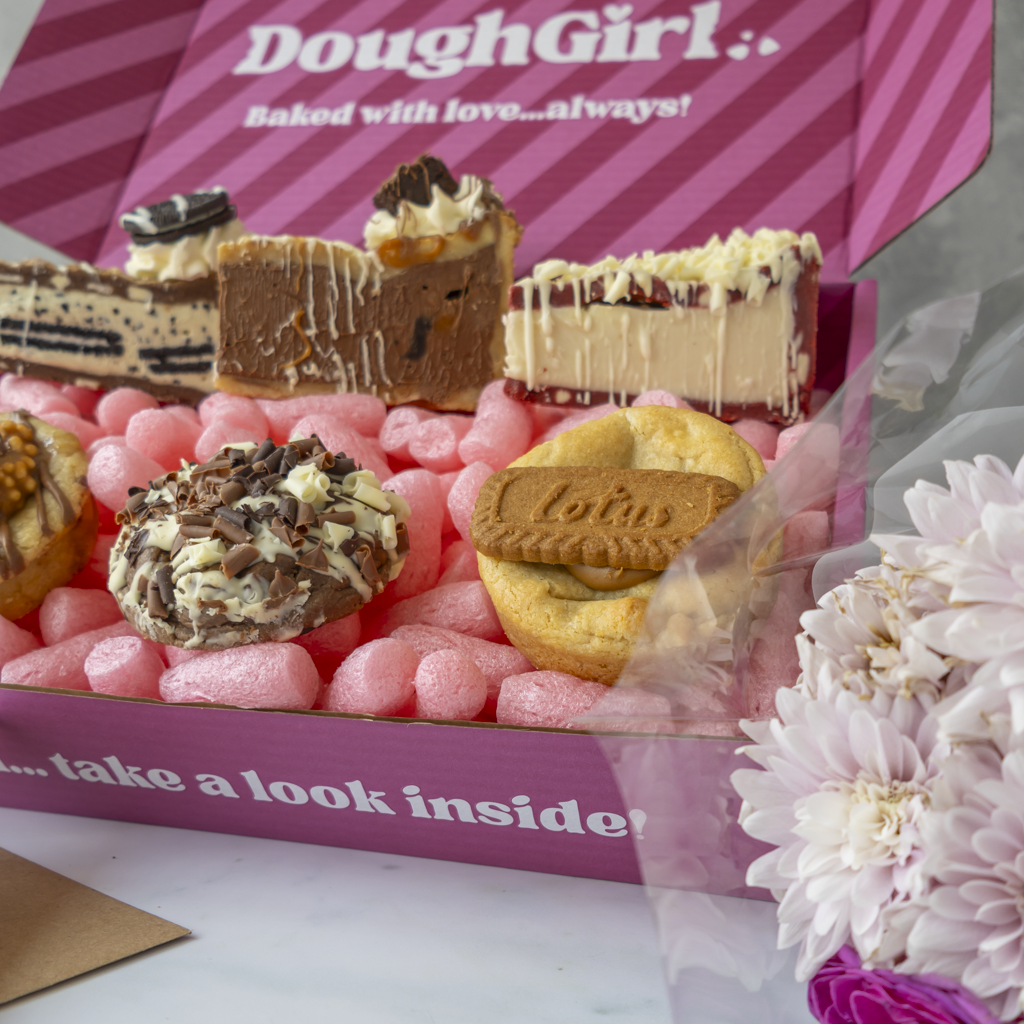 DoughGirl thank you gift box surrounded by colourful flowers