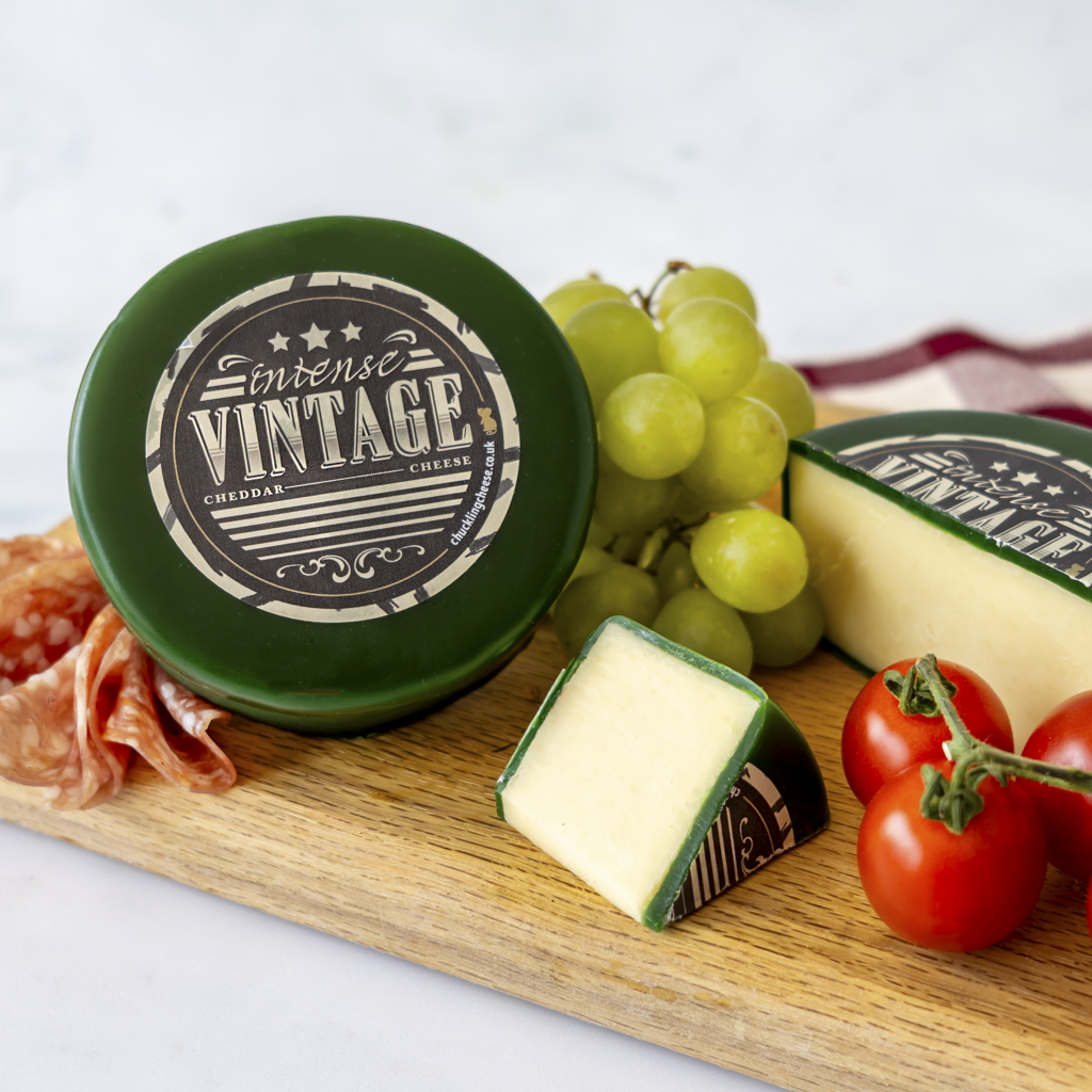 Intense Vintage Cheddar Truckle with tomatoes, grapes and sliced vintage cheddar