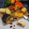 How to throw the perfect New Years Eve party blog. Image of Smoked cheddar on a graze board with accompaniments