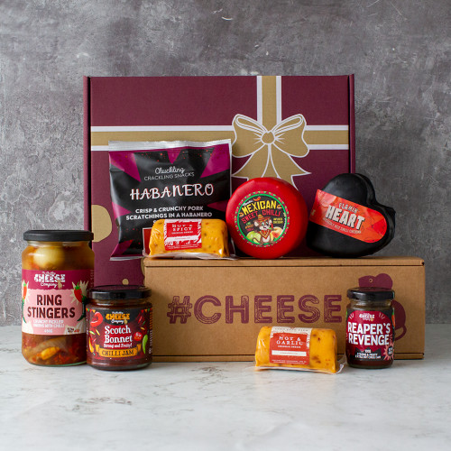 A product image of the All About The Burn Gift Hamper filled with spicy cheese, chilli jams, and pickled onions