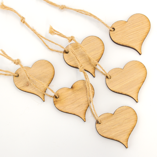 Close up image of a pack of 6 Wooden Heart Shaped Gift Toppers