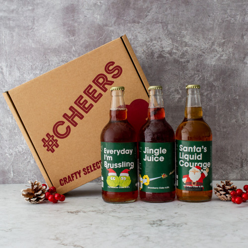 Grey background image of the Christmas comedy cider trio gift box 