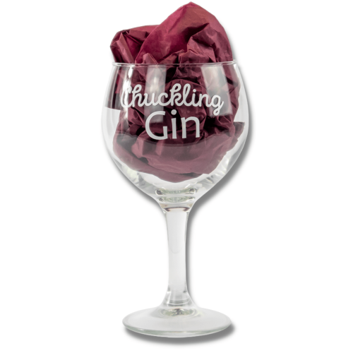 A Chuckling Cheese Gin Glass With Chuckling Gin Slogan Printed On It.