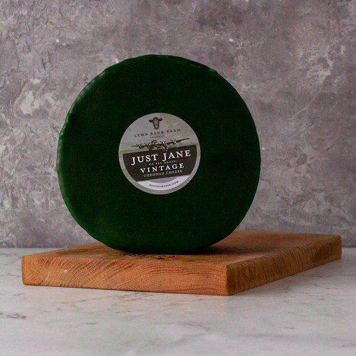 White background image of a 2kg Vintage Large Cheese Truckle Coated in Green Wax