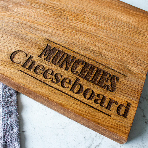 An image of the Chuckling Cheese personalised name oak cheeseboard.