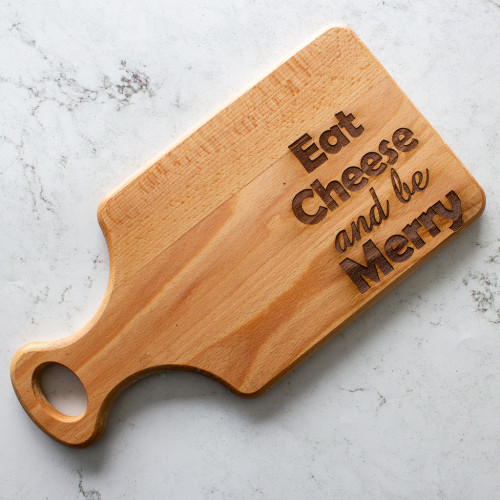 The eat cheese and be merry beech wood board availble to purchase from The Chuckling Cheese Company