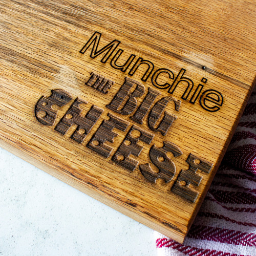 A close up image of the personalised 'The Big Cheese' Oak Cheeseboard by The Chuckling Cheese Company. Personalise this cheeseboard with your chosen name.