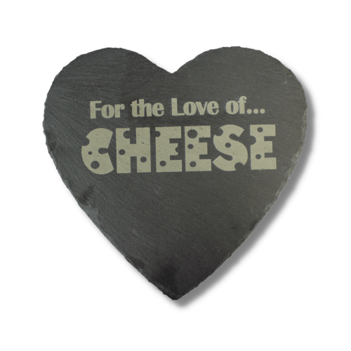 A chuckling cheese heart shaped slate cheeseboard with for the love of cheese engraved on it.
