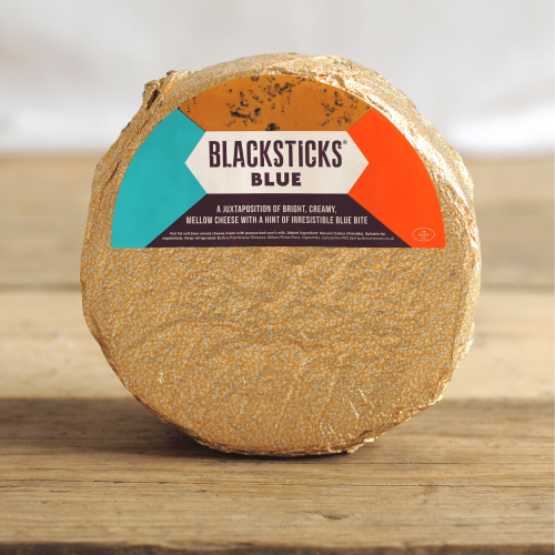 A product shot of a 2.5kg wheel of Black Sticks Blue Cheese by Butler's Cheese.