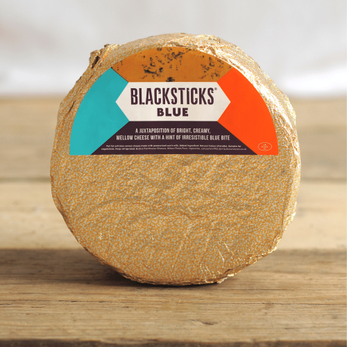 A product shot of a 2.5kg wheel of Black Sticks Blue Cheese by Butler's Cheese.