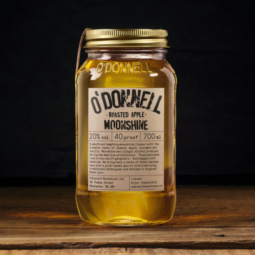 A lifestyle image of a 700ml bottle of Roasted Apple flavoured Moonshine by O'Donnell