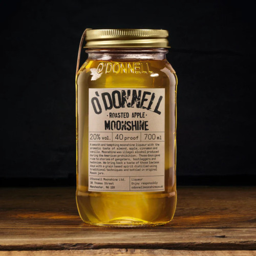 A lifestyle image of a 700ml bottle of Roasted Apple flavoured Moonshine by O'Donnell