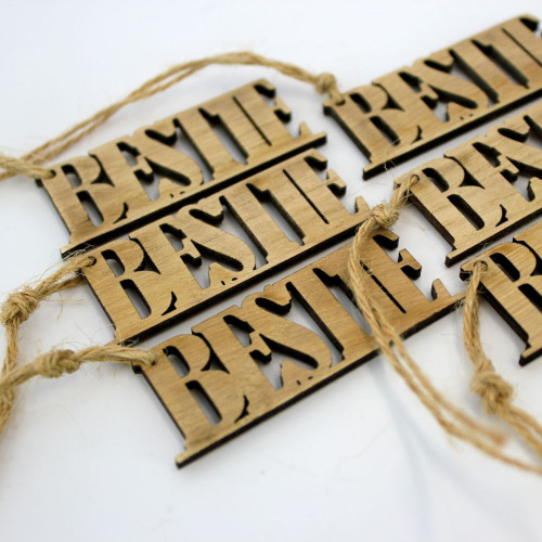 A close-up image of a pack of six 'Bestie' wooden gift tags/toppers, available at The Chuckling Cheese Company.