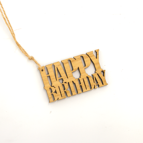 A white background image of a single happy birthday wooden gift topper