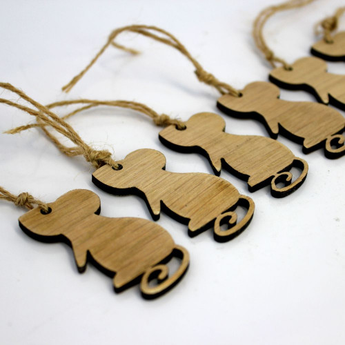 A close up image of a pack of 6 wooden gift tags engraved into the shape of Munchie Mouse