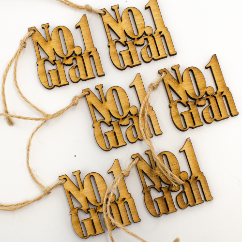 A close up image of a 6 pack of No.1 Gran wooden gift toppers
