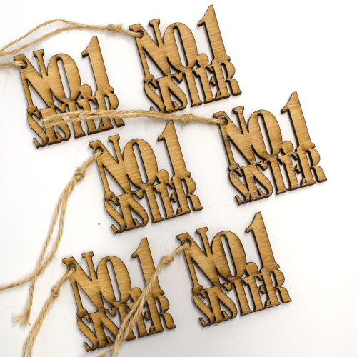 A close up image of a 6 pack of No.1 Sister Wooden Gift Toppers