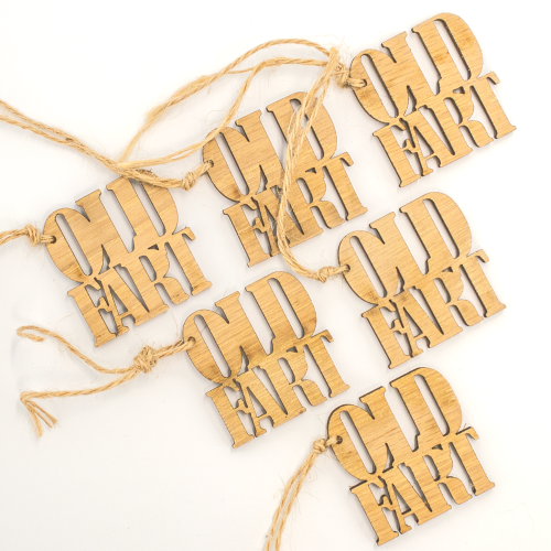 Close up image of a 6 pack of old fart wooden gift toppers