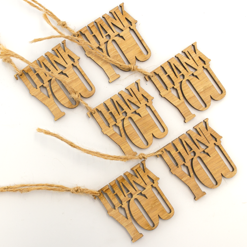 A close up image of a 6 pack of Thank you wooden gift toppers