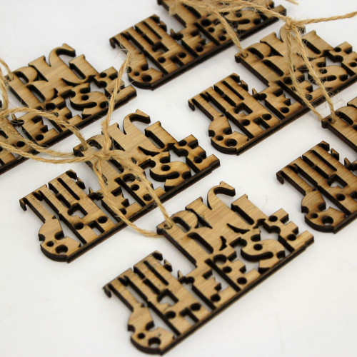 A close up image of the 6 pack of wooden gift tags engraved with the big cheese