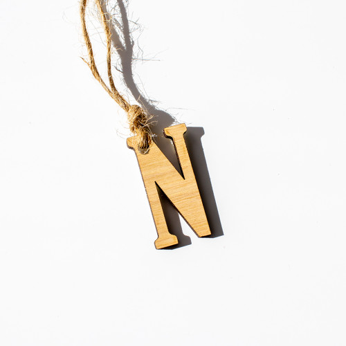 Gift tag made of wooden, in the initial N, availble to purchase from the Chuckling Cheese Company