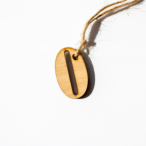 Gift tag made of wood, in the inital O, availble to purchase from the Chuckling Cheese Company