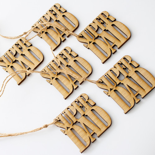 Close up image of a 6 pack of wooden gift tags laser cut to say Super Dad