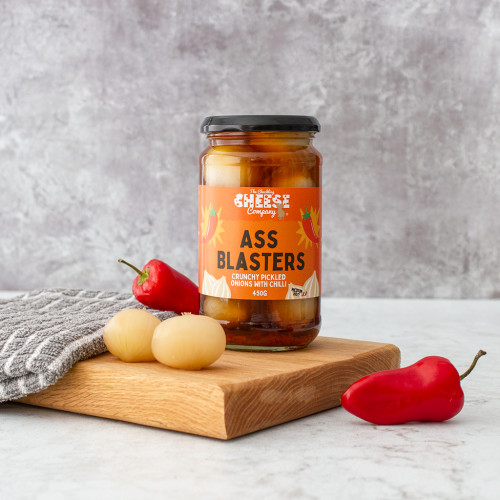 Lifestyle image of a jar of ass blaster pickled onions by the chuckling cheese company