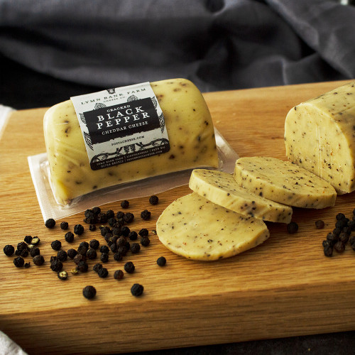 Lifestyle image of the Cracked Black Pepper Cheddar Cheese Barrel