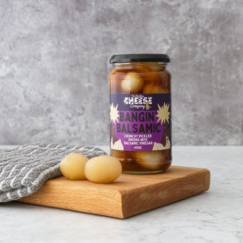 Lifestyle image of a jar of the Bangin' Balsamic pickled onions by the chuckling cheese company
