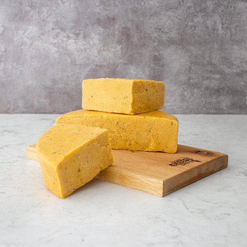 Lifestyle image of a 2.25kg wheel of Double Gloucester and Chive 