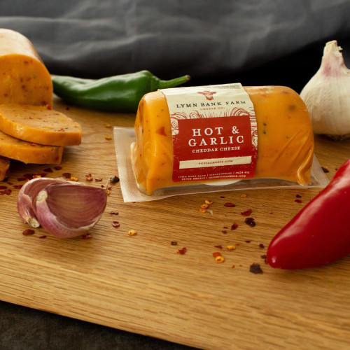 Lifestyle image of the Hot and Garlic Cheddar Cheese Barrel