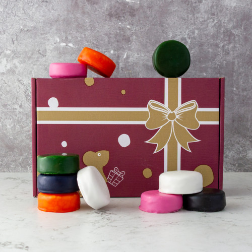 Grey background image of a Mini Cheeseboard Selection Box featuring 10 mini cheddar truckles