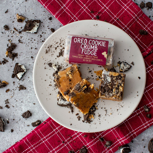 Lifestyle image of a bar of Oreo Cookie Crumb Fudge sprinkled with oreo