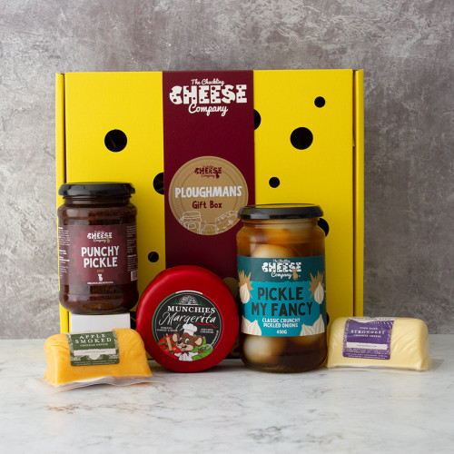 Grey background image of the Ploughman's Gift Box including three cheddars, a jar of punchy pickle and a jar of pickled onions.