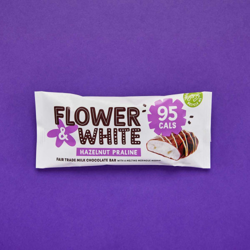 A photo of a Flower and White Hazelnut Praline Meringue Bar in packaging.