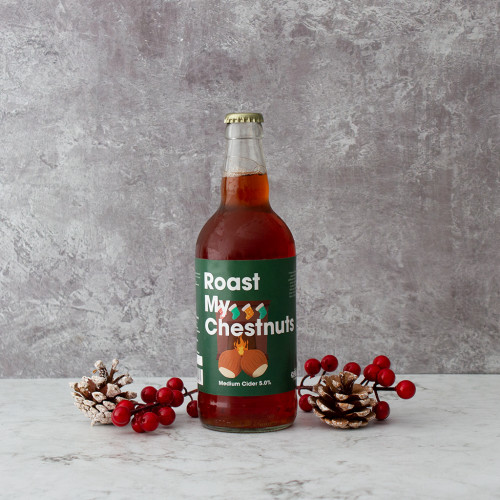 Grey background image of a single bottle of Roast My Chestnuts Cider