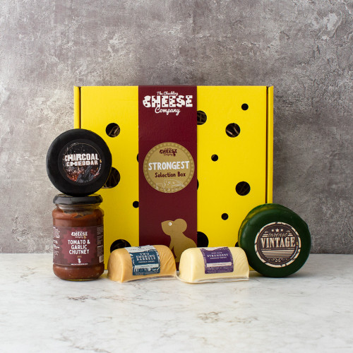 White background image of the Strongest Selection Box including four strong flavoured cheddars and a jar of tomato & garlic chutney