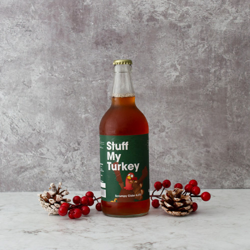 Grey background product image of a single bottle of Stuff My Turkey Cider