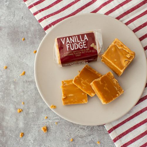 Lifestyle image of Vanilla Fudge Bar on a plate with crumbled fudge