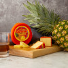 Rum & Pineapple Carnival Cheddar - Waxed Cheese Truckle 190g